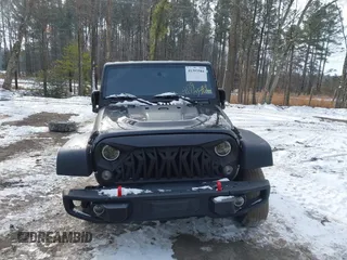 2017 Jeep Wrangler Unlimited Rubicon Recon z VIN 1C4BJWFG4HL723096, wystawiony jako IAAI lot #41393584 z przebiegiem 102 045 mil mil oraz . Historia ofert i sprzedaży dostępna na DreamBid. Obrazek 13.