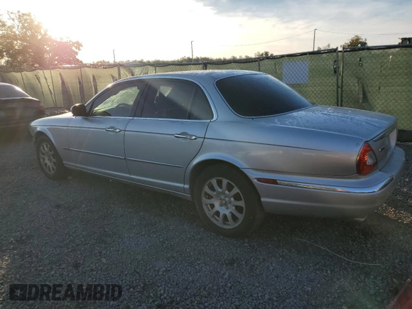 2004 Jaguar XJ with VIN SAJWA71C84SG32106, listed as a Copart auction lot 81837704 with 119,268 mi miles and Salvage Title. Bid and sale history available at carsss.com. Image 2.