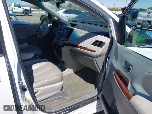 2011 Toyota Sienna XLE with VIN 5TDDK3DCXBS029961, listed as a IAAI auction lot 42228356 with 251,571 mi miles and . Bid and sale history available at DreamBid. Image 5.