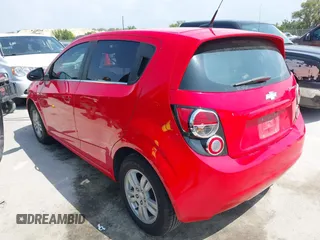 2014 Chevrolet Sonic LT with VIN 1G1JC6SH7E4135650, listed as a IAAI auction lot 41954694 with 103,944 mi miles. Bid and sale history available at carsss.com. Image 3.