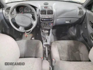 2000 Hyundai Accent z VIN KMHCG45G4YU090520, wystawiony jako Copart lot #79705864 z przebiegiem 145 490 mil mil oraz Szkoda całkowita • Salvage title. Historia ofert i sprzedaży dostępna na DreamBid. Obrazek 8.