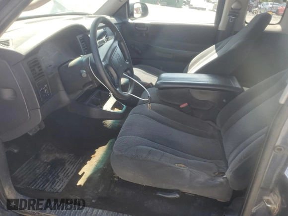 2001 Dodge Dakota z VIN 1B7GL22X91S338711, wystawiony jako Copart lot #54914095 z przebiegiem 200 216 mil mil oraz Szkoda całkowita • Salvage title. Historia ofert i sprzedaży dostępna na DreamBid. Obrazek 7.