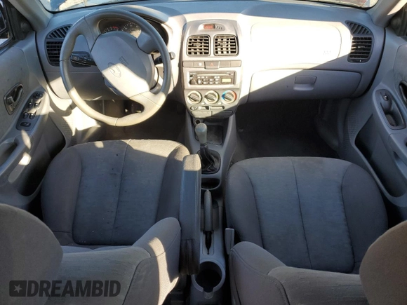 2005 Hyundai Accent GLS z VIN KMHCG45C15U662362, wystawiony jako Copart lot #80574774 z przebiegiem 122 898 mil mil oraz Szkoda całkowita • Salvage title. Historia ofert i sprzedaży dostępna na DreamBid. Obrazek 8.