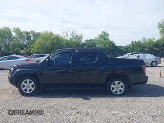 2008 Honda Ridgeline RTL z VIN 2HJYK16518H541213, wystawiony jako IAAI lot #42297012 z przebiegiem 194 098 mil mil oraz . Historia ofert i sprzedaży dostępna na DreamBid. Obrazek 14.