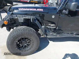 2013 Jeep Wrangler Unlimited Sahara with VIN 1C4BJWEG3DL617511, listed as a IAAI auction lot 41842979 with 149,980 mi miles and . Bid and sale history available at DreamBid. Image 6.