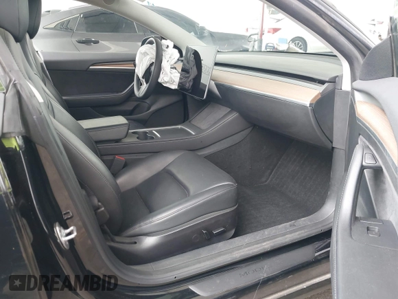 2023 Tesla Model 3 with VIN 5YJ3E1EA7PF473749, listed as a IAAI auction lot 41921478 with 21,483 mi miles and . Bid and sale history available at DreamBid. Image 5.