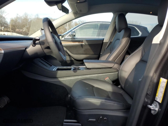 2024 Tesla Model Y with VIN 7SAYGDED1RF016792, listed as a Copart auction lot 50057345 with 6,749 mi miles and Salvage Title. Bid and sale history available at carsss.com. Image 7.