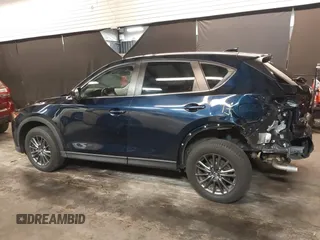 2020 Mazda CX-5 Touring with VIN JM3KFBCM5L0751284, listed as a IAAI auction lot 42157556 with 50,011 mi miles and . Bid and sale history available at DreamBid. Image 14.