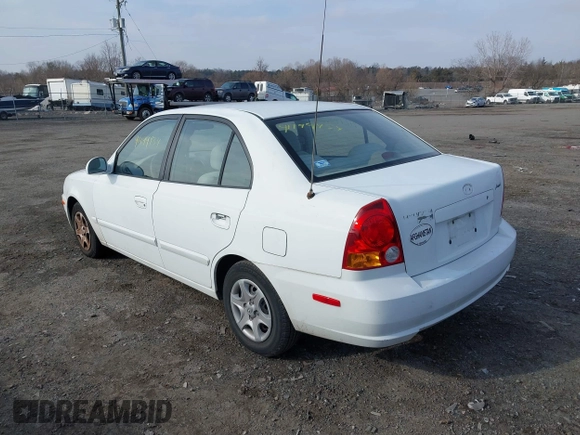 2004 Hyundai Accent GL with VIN KMHCG45C64U539526, listed as a IAAI auction lot 41199434 with 81,442 mi miles. Bid and sale history available at carsss.com. Image 3.