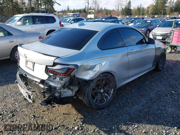 2015 BMW 2 Series 228i with VIN WBA1F5C55FV343662, listed as a IAAI auction lot 41729309 with 90,770 mi miles. Bid and sale history available at carsss.com. Image 4.