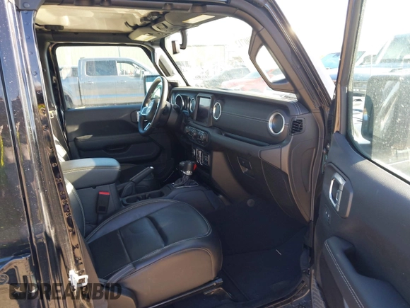 2023 Jeep Wrangler Sahara z VIN 1C4JJXP60PW627051, wystawiony jako IAAI lot #42290712 z przebiegiem 28 269 mil mil oraz . Historia ofert i sprzedaży dostępna na DreamBid. Obrazek 5.