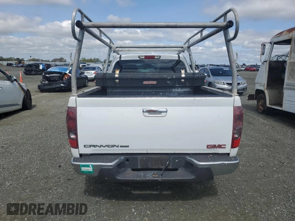 2012 GMC Canyon z VIN 1GTE5MFE6C8169267, wystawiony jako Copart lot #50096415 z przebiegiem 192 546 mil mil oraz Czysty tytuł • Clean title. Historia ofert i sprzedaży dostępna na DreamBid. Obrazek 6.