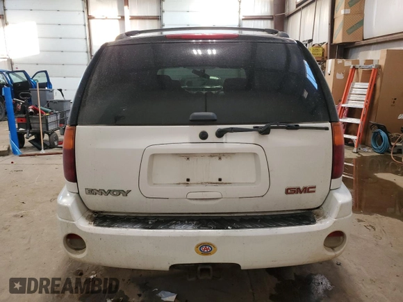 2004 GMC Envoy SLT with VIN 1GKDT13S042257444, listed as a Copart auction lot 89137605 with 301,920 mi miles and Salvage Title. Bid and sale history available at carsss.com. Image 6.