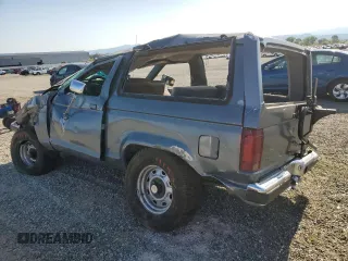 1989 Ford Bronco with VIN 1FMCU14T0KUA33910, listed as a Copart auction lot 57730195 with 53,335 mi miles and Salvage title. Bid and sale history available at DreamBid. Image 2.