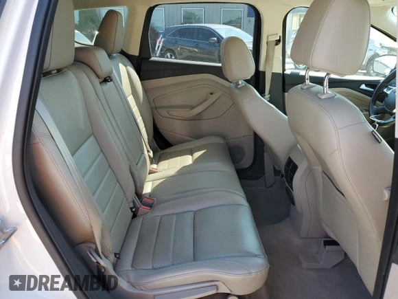 2015 Ford Escape Titanium with VIN 1FMCU0J93FUA58325, listed as a Copart auction lot 64135685 with 126,356 mi miles and Salvage title. Bid and sale history available at DreamBid. Image 11.