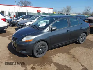 2009 Toyota Yaris with VIN JTDBT903194047784, listed as a IAAI auction lot 42049872 with 115,735 mi miles. Bid and sale history available at carsss.com. Image 17.
