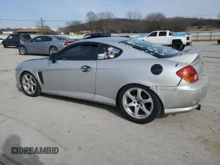 2003 Hyundai Tiburon GT z VIN KMHHN65F13U102985, wystawiony jako Copart lot #45294325 z przebiegiem 326 919 mil mil oraz Szkoda całkowita • Salvage title. Historia ofert i sprzedaży dostępna na DreamBid. Obrazek 2.