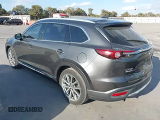 2016 Mazda CX-9 Grand Touring with VIN JM3TCADY8G0114940, listed as a IAAI auction lot 40701187 with 112,311 mi miles and . Bid and sale history available at DreamBid. Image 3.