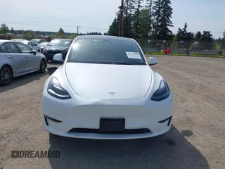 2023 Tesla Model Y Long Range with VIN 7SAYGDEE4PF676167, listed as a IAAI auction lot 42147909 with 20,488 mi miles. Bid and sale history available at carsss.com. Image 13.