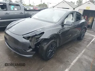 2025 Tesla Model Y Long Range with VIN 7SAYGDED8SA340082, listed as a IAAI auction lot 41915369 with 7,296 mi miles and . Bid and sale history available at DreamBid. Image 20.