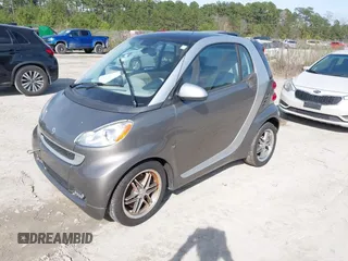 2012 Smart fortwo Pure z VIN WMEEJ3BA9CK557221, wystawiony jako IAAI lot #41828029 z przebiegiem 54 516 mil mil oraz . Historia ofert i sprzedaży dostępna na DreamBid. Obrazek 2.