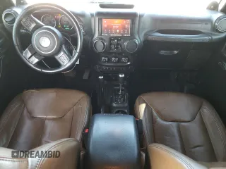 2013 Jeep Wrangler Unlimited Moab with VIN 1C4HJWEG7DL600043, listed as a Copart auction lot 52146945 with 118,882 mi miles and Salvage title. Bid and sale history available at DreamBid. Image 8.