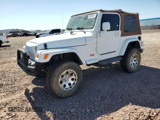 2003 Jeep Wrangler Sahara z VIN 1J4FA59S73P312279, wystawiony jako Copart lot #60230445 z przebiegiem 151 886 mil mil oraz Czysty tytuł • Clean title. Historia ofert i sprzedaży dostępna na DreamBid. Obrazek 1.