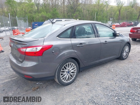 2013 Ford Focus Titanium with VIN 1FADP3J28DL225887, listed as a IAAI auction lot 42122968 with 139,248 mi miles and . Bid and sale history available at carsss.com. Image 4.