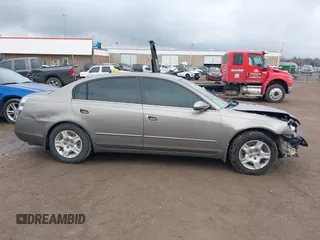 2003 Nissan Altima S z VIN 1N4AL11D53C347450, wystawiony jako IAAI lot #41523818 z przebiegiem 75 885 mil mil oraz . Historia ofert i sprzedaży dostępna na DreamBid. Obrazek 14.