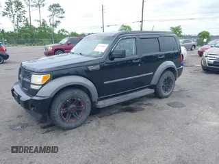 2007 Dodge Nitro SXT with VIN 1D8GT28K17W605984, listed as a IAAI auction lot 41970841 with 118,700 mi miles. Bid and sale history available at carsss.com. Image 2.