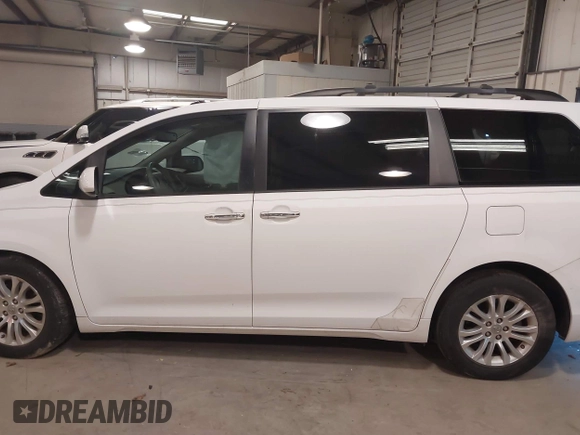 2011 Toyota Sienna XLE AAS with VIN 5TDYK3DC5BS130066, listed as a IAAI auction lot 41294340 with 156,591 mi miles and . Bid and sale history available at DreamBid. Image 14.