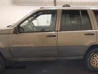 1996 Jeep Grand Cherokee Laredo with VIN 1J4GZ58S5TC182766, listed as a IAAI auction lot 41372356 with 234,390 mi miles. Bid and sale history available at carsss.com. Image 15.