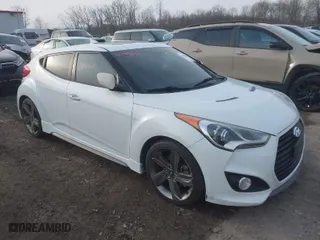2014 Hyundai Veloster Turbo with VIN KMHTC6AEXEU197370, listed as a IAAI auction lot 41999805 with 120,779 mi miles. Bid and sale history available at carsss.com. Image 1.