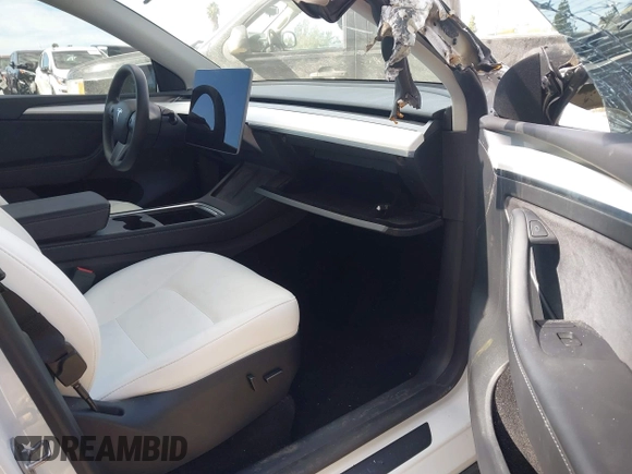 2023 Tesla Model Y Performance with VIN 7SAYGDEF0PF839468, listed as a IAAI auction lot 41609263 with 25,434 mi miles and . Bid and sale history available at DreamBid. Image 5.