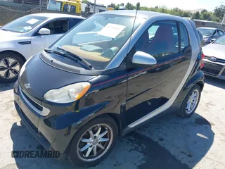 2008 Smart fortwo Pure with VIN WMEEJ31X78K180398, listed as a IAAI auction lot 42193886 with 98,136 mi miles and . Bid and sale history available at DreamBid. Image 2.