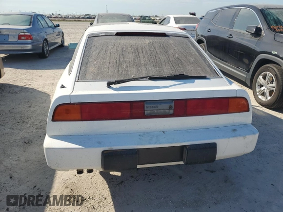 1988 Nissan 300ZX GS z VIN JN1HZ16S6JX204756, wystawiony jako Copart lot #75877174 z przebiegiem Nie podano mil oraz Szkody całkowita. Historia ofert i sprzedaży dostępna na DreamBid. Obrazek 6.