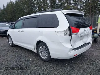 2014 Toyota Sienna XLE with VIN 5TDYK3DC2ES485846, listed as a IAAI auction lot 41693092 with 106,156 mi miles and . Bid and sale history available at DreamBid. Image 3.