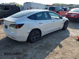 2023 Tesla Model 3 with VIN 5YJ3E1EA3PF617460, listed as a IAAI auction lot 42154401 with 9,578 mi miles and . Bid and sale history available at DreamBid. Image 4.