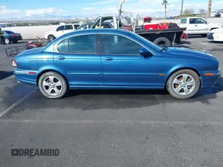 2002 Jaguar X-Type with VIN SAJEA51C42WC11103, listed as a IAAI auction lot 41699366 with 106,418 mi miles and . Bid and sale history available at DreamBid. Image 12.