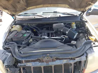 2004 Jeep Grand Cherokee Laredo z VIN 1J4GW48SX4C283922, wystawiony jako IAAI lot #42306869 z przebiegiem 263 812 mil mil oraz . Historia ofert i sprzedaży dostępna na DreamBid. Obrazek 10.