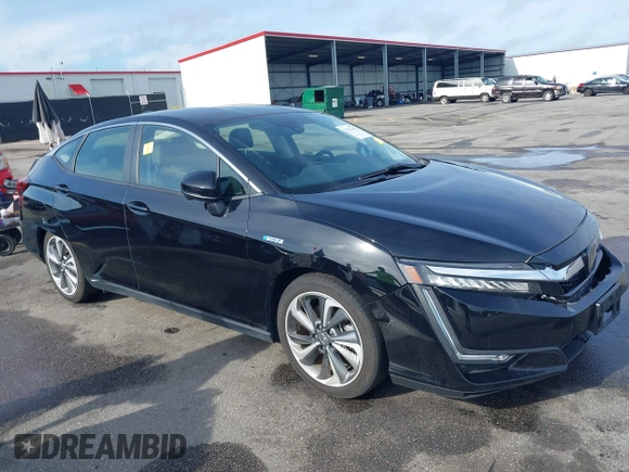 2021 Honda Clarity Touring z VIN JHMZC5F3XMC001253, wystawiony jako IAAI lot #42212102 z przebiegiem 35 649 mil mil oraz . Historia ofert i sprzedaży dostępna na DreamBid. Obrazek 1.