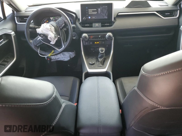 2024 Toyota RAV4 Hybrid XLE Premium with VIN JTMB6RFV6RD120633, listed as a Copart auction lot 57620825 with 28,817 mi miles and Salvage title. Bid and sale history available at DreamBid. Image 8.