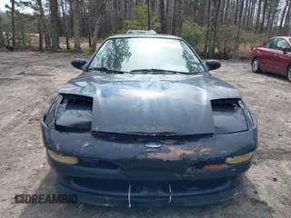 1995 Ford Probe z VIN 1ZVLT22B1S5104093, wystawiony jako IAAI lot #41744654 z przebiegiem 166 253 mil mil oraz . Historia ofert i sprzedaży dostępna na DreamBid. Obrazek 12.