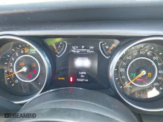 2018 Jeep Wrangler Unlimited Sport S with VIN 1C4HJXDG5JW147316, listed as a IAAI auction lot 41776654 with 92,227 mi miles. Bid and sale history available at carsss.com. Image 7.