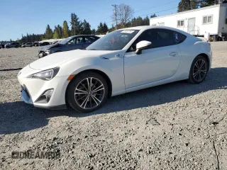 2015 Scion FR-S z VIN JF1ZNAA10F9703212, wystawiony jako Copart lot #53650755 z przebiegiem 99 741 mil mil oraz Szkoda całkowita • Salvage title. Historia ofert i sprzedaży dostępna na DreamBid. Obrazek 1.