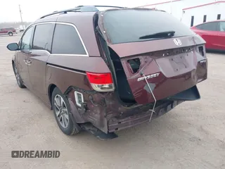 2014 Honda Odyssey Touring with VIN 5FNRL5H97EB117971, listed as a IAAI auction lot 41794324 with 198,191 mi miles and . Bid and sale history available at DreamBid. Image 3.