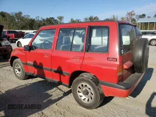 1998 Suzuki Sidekick JS z VIN 2S3TE02V3W6406072, wystawiony jako Copart lot #75855544 z przebiegiem 120 359 mil mil oraz Szkody całkowita. Historia ofert i sprzedaży dostępna na DreamBid. Obrazek 2.