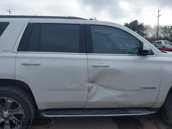 2019 GMC Yukon SLT with VIN 1GKS1BKCXKR329607, listed as a IAAI auction lot 41188239 with 84,940 mi miles. Bid and sale history available at carsss.com. Image 13.