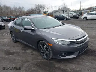 2017 Honda Civic Sedan Touring with VIN 19XFC1F95HE203613, listed as a IAAI auction lot 41956386 with 63,000 mi miles. Bid and sale history available at carsss.com. Image 1.