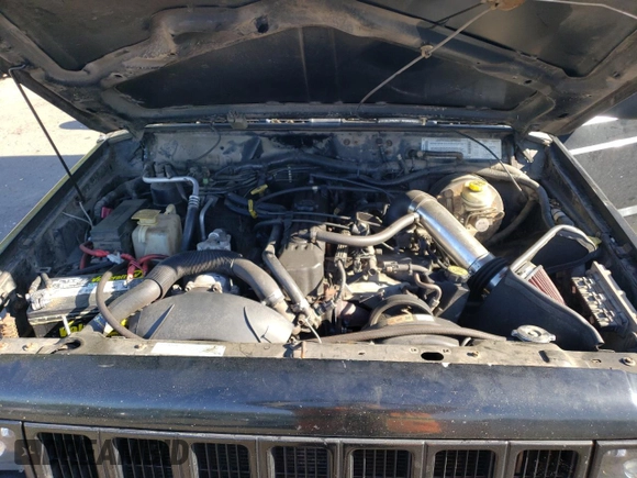 2000 Jeep Cherokee z VIN 1J4FF48S3YL180200, wystawiony jako Copart lot #55994215 z przebiegiem 209 182 mil mil oraz Szkoda całkowita • Salvage title. Historia ofert i sprzedaży dostępna na DreamBid. Obrazek 12.